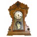 Oak Mantel Clock with Brass Figural Head and Trim